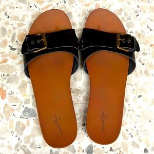 Black slide sandals with buckle